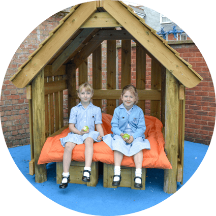 two children in a play hut
