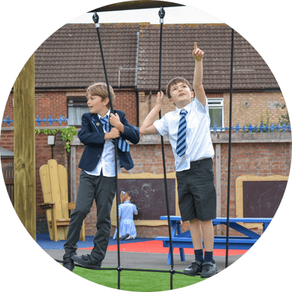 school children on climbing net